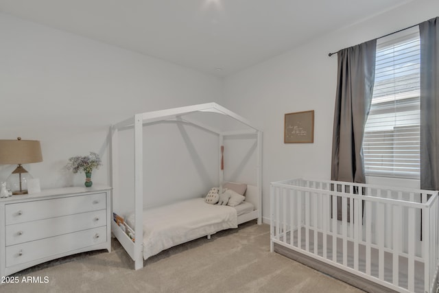 bedroom featuring light colored carpet