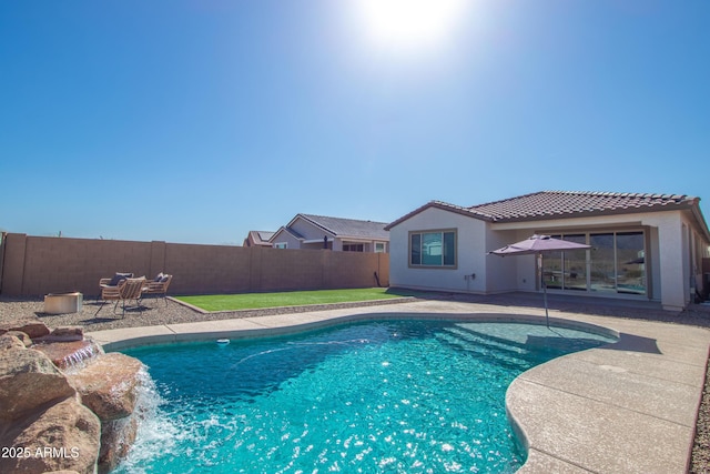 view of pool featuring a patio area, a fenced backyard, and a fenced in pool