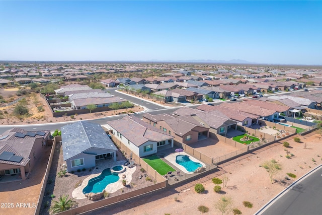 birds eye view of property with a residential view