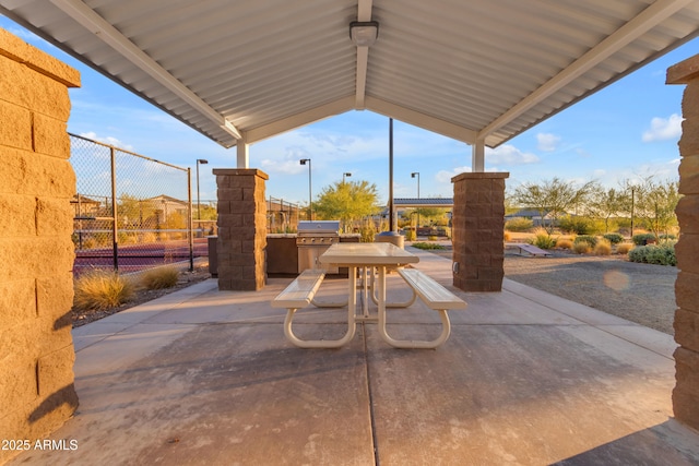 view of patio / terrace featuring grilling area and fence