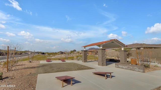 view of property's community featuring a patio area and a fenced backyard