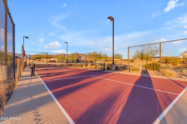 view of sport court featuring community basketball court and fence