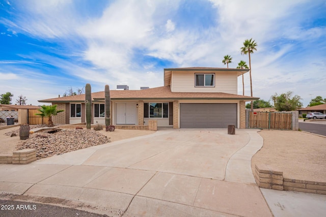 9803 N 40th Dr, Phoenix, AZ 85051 - view of front facade with brick siding, an attached garage, driveway, and a shingled roof
