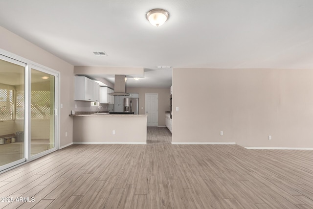 9803 N 40th Dr, Phoenix, AZ 85051 - unfurnished living room with light wood-style floors and baseboards