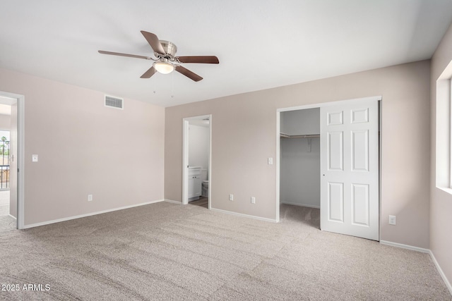 9803 N 40th Dr, Phoenix, AZ 85051 - unfurnished bedroom featuring carpet floors, baseboards, ensuite bathroom, and ceiling fan