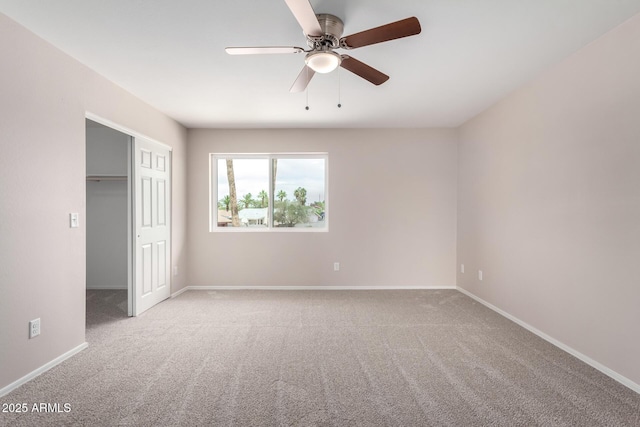 9803 N 40th Dr, Phoenix, AZ 85051 - unfurnished bedroom featuring light colored carpet, a closet, baseboards, and a ceiling fan