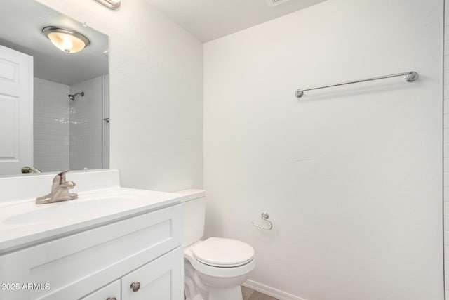 9803 N 40th Dr, Phoenix, AZ 85051 - bathroom with vanity, toilet, a shower, and baseboards