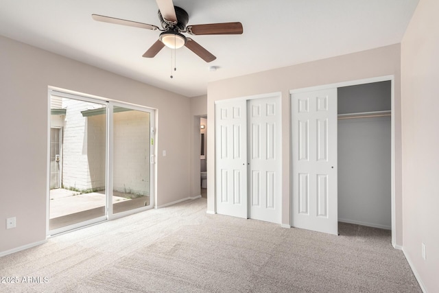9803 N 40th Dr, Phoenix, AZ 85051 - unfurnished bedroom with multiple closets, carpet, and baseboards