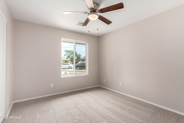 9803 N 40th Dr, Phoenix, AZ 85051 - carpeted spare room with baseboards and a ceiling fan
