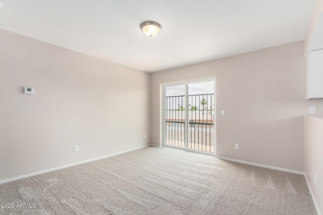 9803 N 40th Dr, Phoenix, AZ 85051 - empty room with light carpet and baseboards