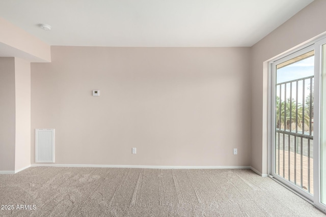 9803 N 40th Dr, Phoenix, AZ 85051 - spare room featuring carpet floors, baseboards, and a smoke detector