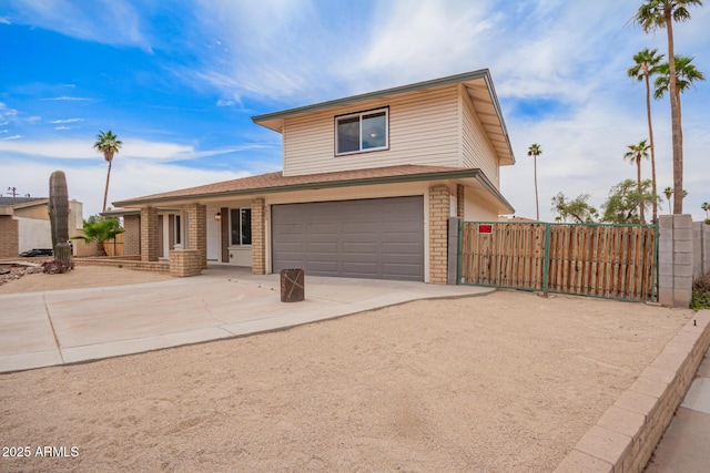 9803 N 40th Dr, Phoenix, AZ 85051 - traditional-style home with a gate, concrete driveway, a garage, and brick siding
