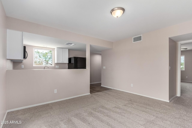 9803 N 40th Dr, Phoenix, AZ 85051 - carpeted empty room with baseboards