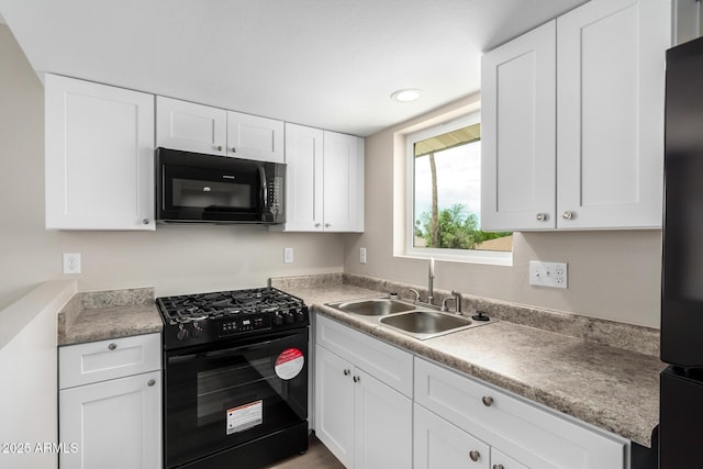 9803 N 40th Dr, Phoenix, AZ 85051 - kitchen with black appliances, a sink, white cabinets, light countertops, and recessed lighting