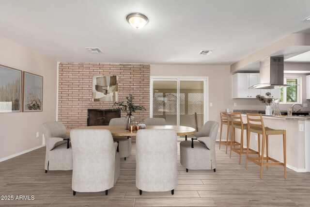 9803 N 40th Dr, Phoenix, AZ 85051 - dining room with light wood-type flooring and baseboards