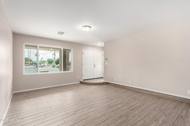 9803 N 40th Dr, Phoenix, AZ 85051 - spare room featuring wood finished floors and baseboards