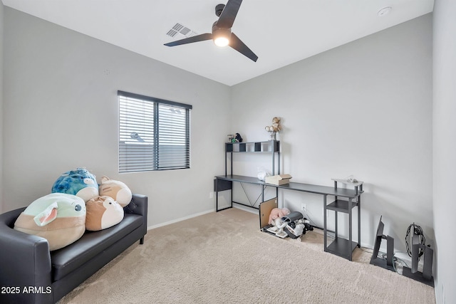 sitting room with ceiling fan and light carpet