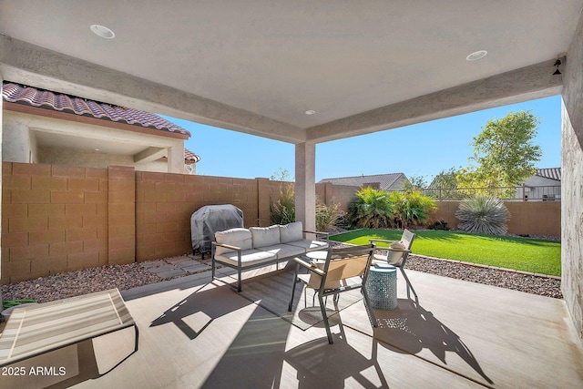 view of patio / terrace with outdoor lounge area and a grill