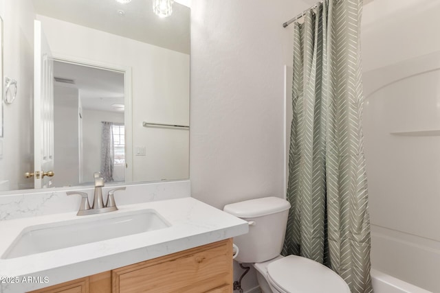 full bath with visible vents, toilet, vanity, and shower / tub combo with curtain