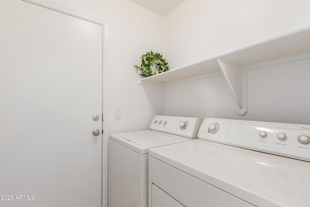 washroom with laundry area and washer and dryer