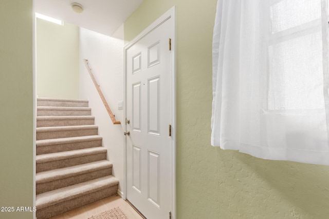 stairway with a wealth of natural light