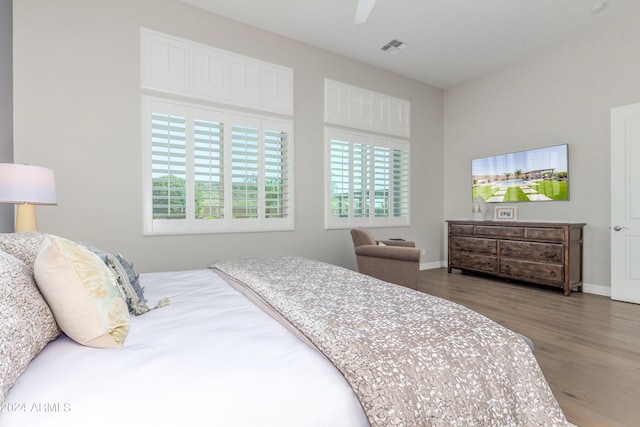 bedroom with hardwood / wood-style flooring and ceiling fan