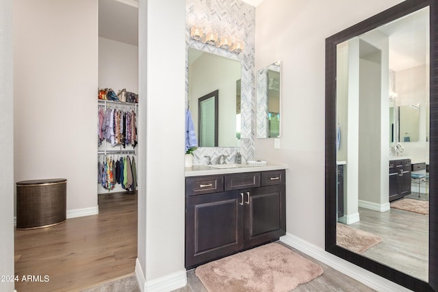 bathroom featuring vanity and hardwood / wood-style flooring