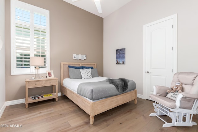 bedroom featuring hardwood / wood-style flooring and ceiling fan