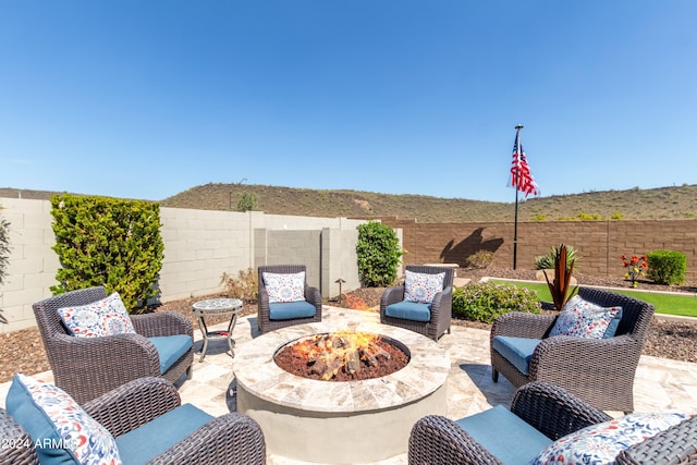 view of patio / terrace featuring an outdoor fire pit