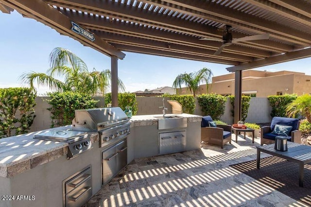 view of patio / terrace with area for grilling, ceiling fan, and sink