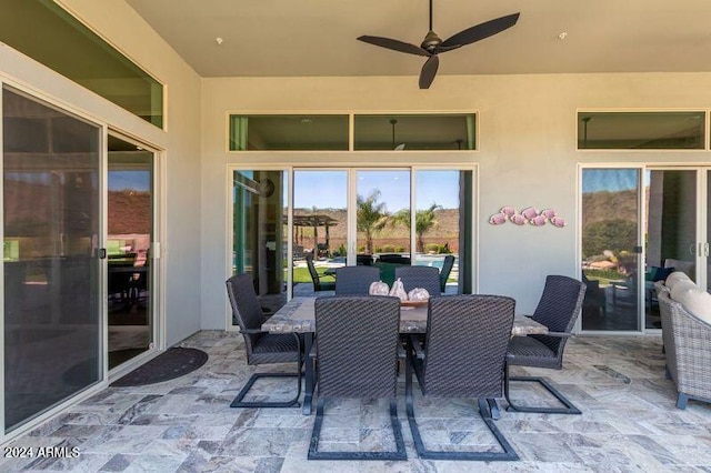 view of patio featuring ceiling fan