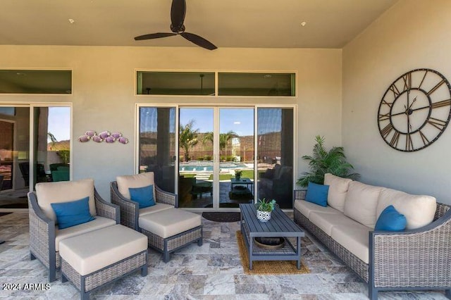 view of patio with an outdoor living space and ceiling fan