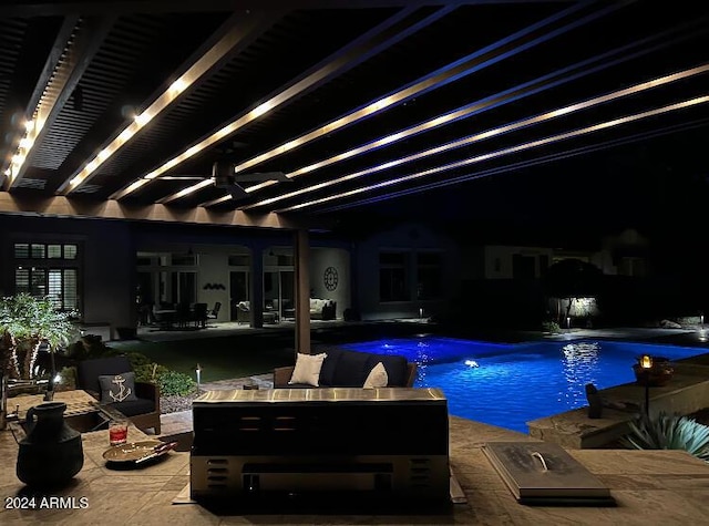 view of pool with ceiling fan, a pergola, and a patio