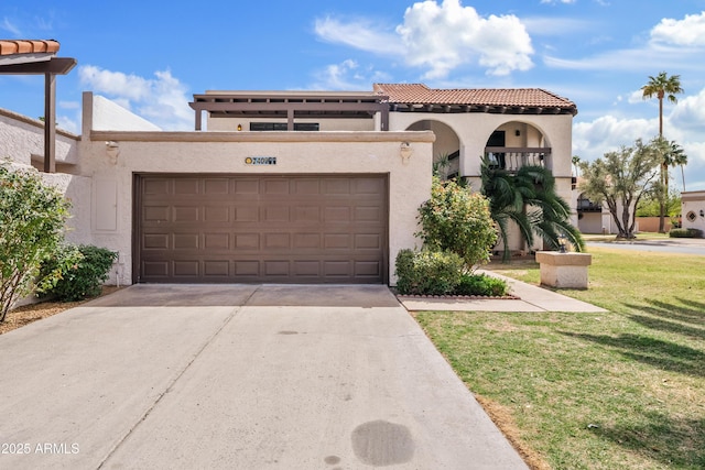 7409 E Pleasant Run, Scottsdale, AZ 85258 - mediterranean / spanish home with stucco siding, an attached garage, driveway, and a front yard