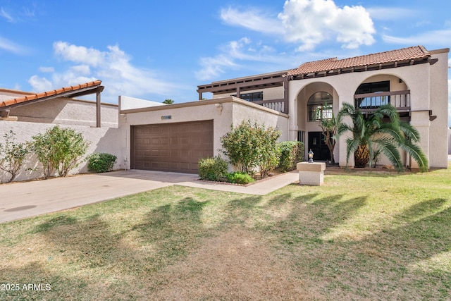 7409 E Pleasant Run, Scottsdale, AZ 85258 - mediterranean / spanish-style house featuring stucco siding, an attached garage, a tiled roof, concrete driveway, and a front lawn