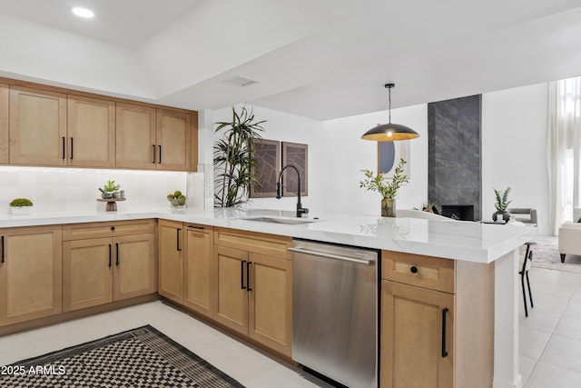 7409 E Pleasant Run, Scottsdale, AZ 85258 - kitchen featuring dishwasher, a sink, a peninsula, light countertops, and light tile patterned flooring