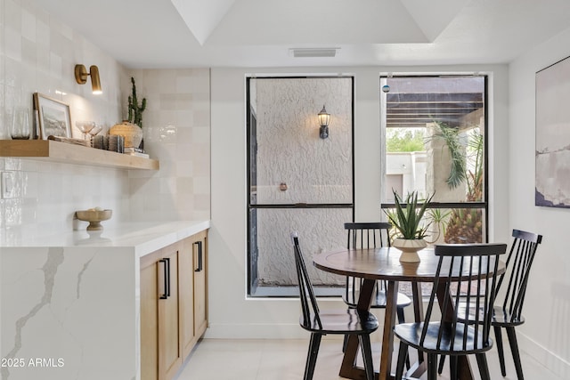 7409 E Pleasant Run, Scottsdale, AZ 85258 - dining room with baseboards and light tile patterned flooring