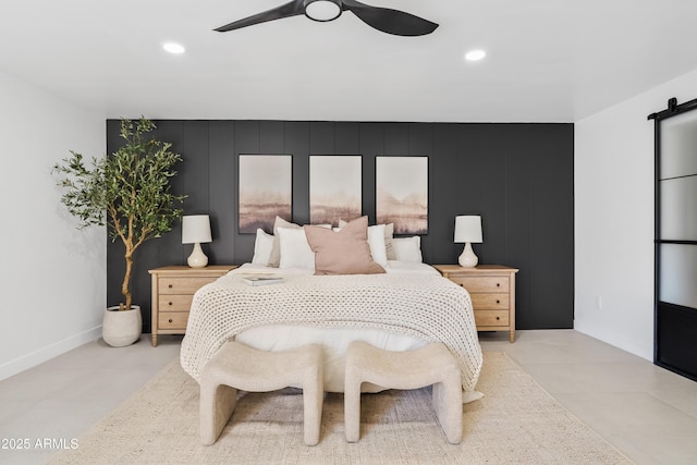 7409 E Pleasant Run, Scottsdale, AZ 85258 - bedroom featuring recessed lighting, a barn door, and a ceiling fan