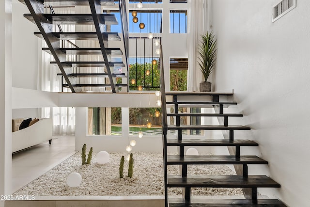 7409 E Pleasant Run, Scottsdale, AZ 85258 - stairway featuring healthy amount of natural light