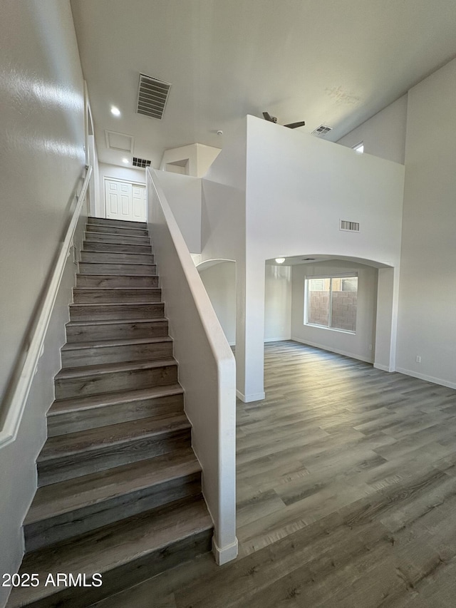 staircase featuring hardwood / wood-style flooring