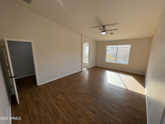 unfurnished room with ceiling fan and dark hardwood / wood-style floors