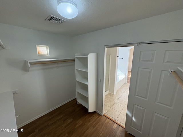 walk in closet featuring wood-type flooring