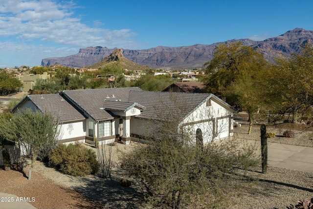 view of front of house with a mountain view and a garage