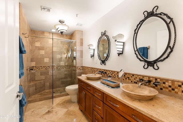 bathroom featuring walk in shower, vanity, and toilet