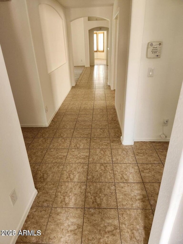 corridor featuring tile patterned flooring