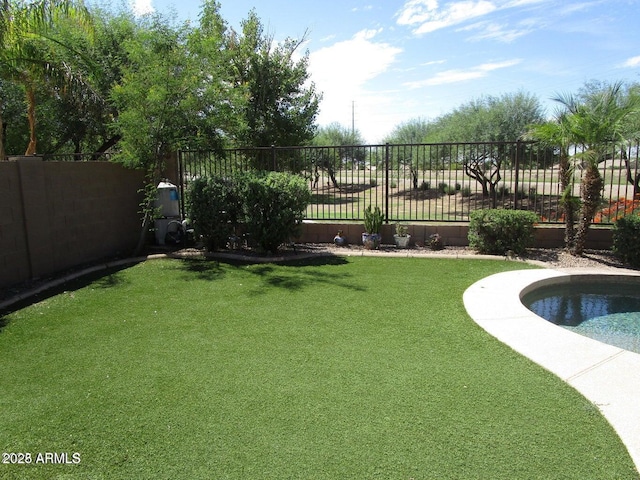 view of yard featuring a fenced in pool