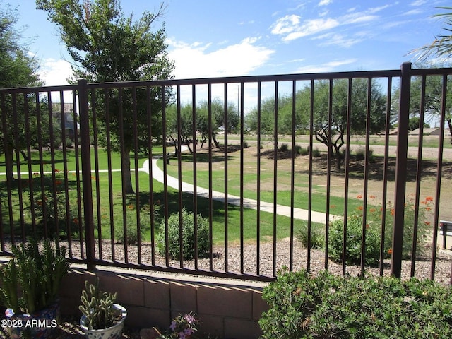 view of gate featuring a yard