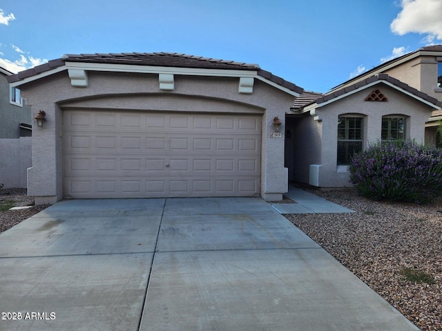 view of front of property with a garage