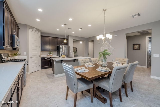 dining space with baseboards, visible vents, recessed lighting, and a notable chandelier