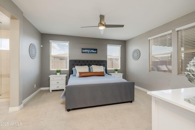 bedroom featuring baseboards, light colored carpet, and multiple windows